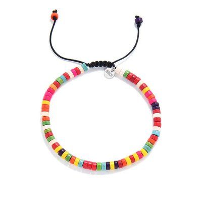 Adjustable bracelet with colorful beads in rainbow tones.