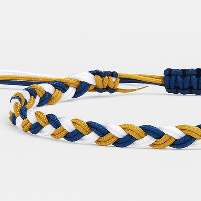 Close-up of adjustable friendship bracelet in blue, white, and gold cords
