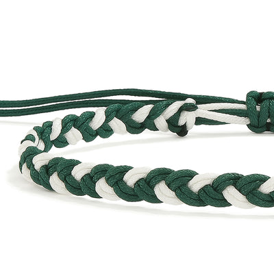Close-up of adjustable friendship bracelet with green and white braided cord