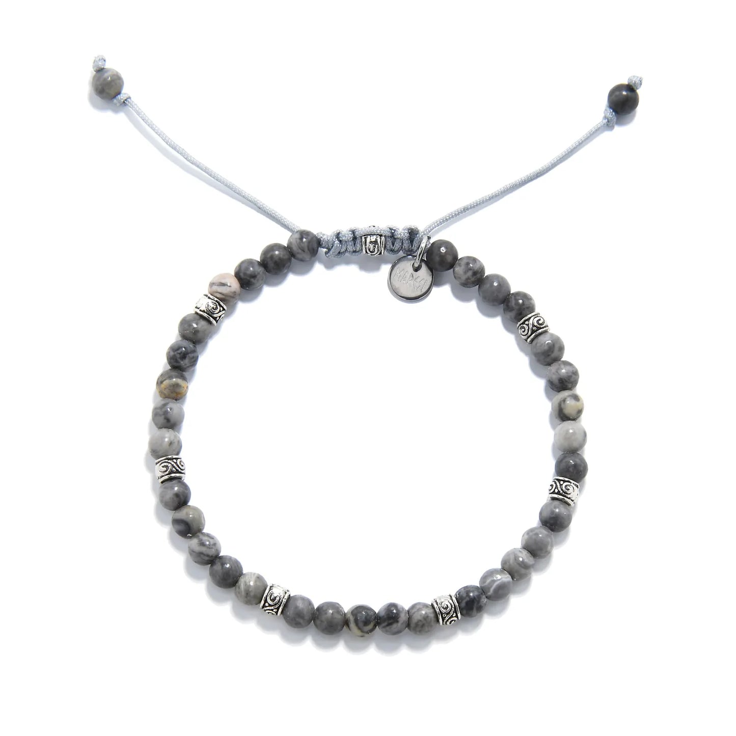 Top view of gray stone bracelet showing full circular layout and detailed silver spacers