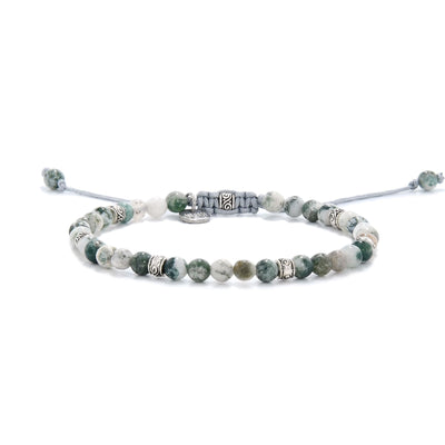 Adjustable moss agate bracelet with gemstone beads and cord.