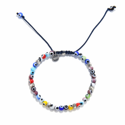 Flat lay of evil eye bracelet showcasing symmetrical bead arrangement and handmade detail