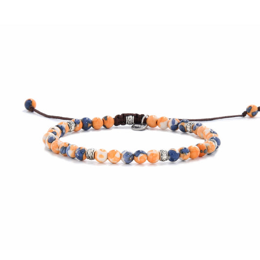 Adjustable orange stone bracelet with blue, white, and silver bead details on brown cord.