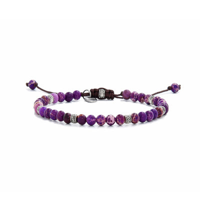 Full view of a purple jasper bracelet with silver spacers and brown adjustable cord.