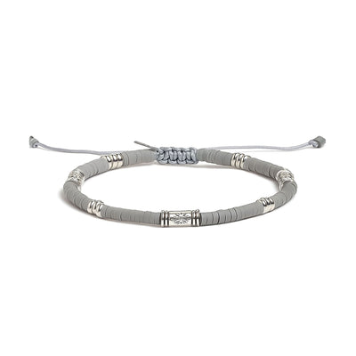 Gray Shamballa bracelet with metal decorative beads and adjustable closure.