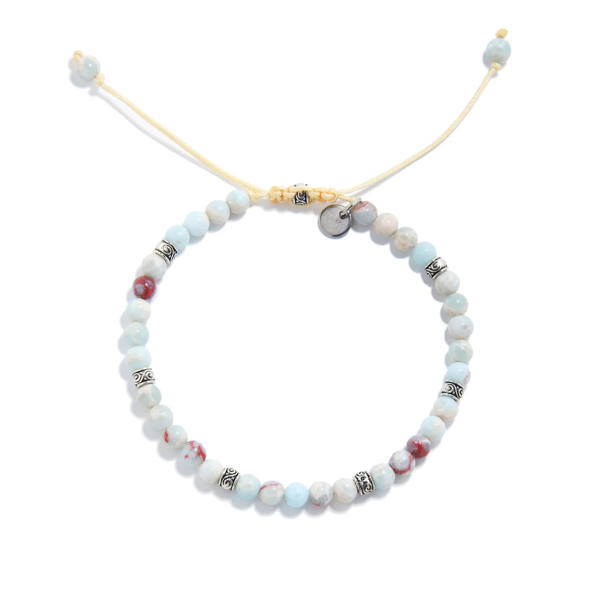 Top-down view of a circular Shoushan stone bracelet with evenly spaced silver spacers and an adjustable yellow cord, highlighting the soft pastel color palette.