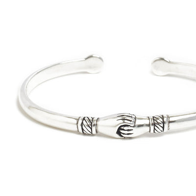 Stainless steel bracelets with adjustable open cuff design.