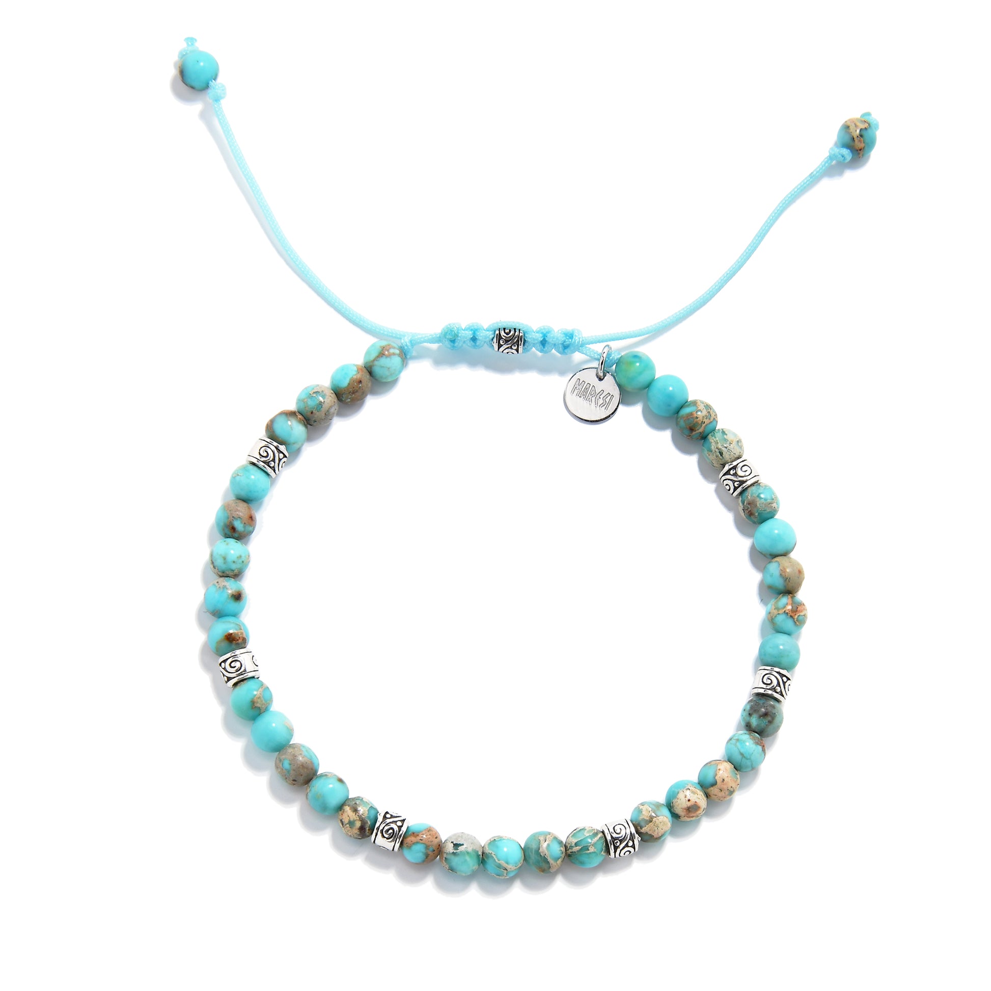 Turquoise jewelry bracelet with round beads and silver accents, displayed in a circular layout.