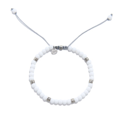 Adjustable white jade stone bead bracelet with silver decorative spacers.