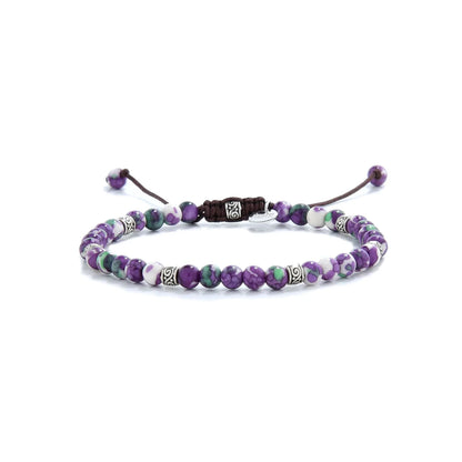 purple gemstone bracelet with silver spacers and multicolor beads.