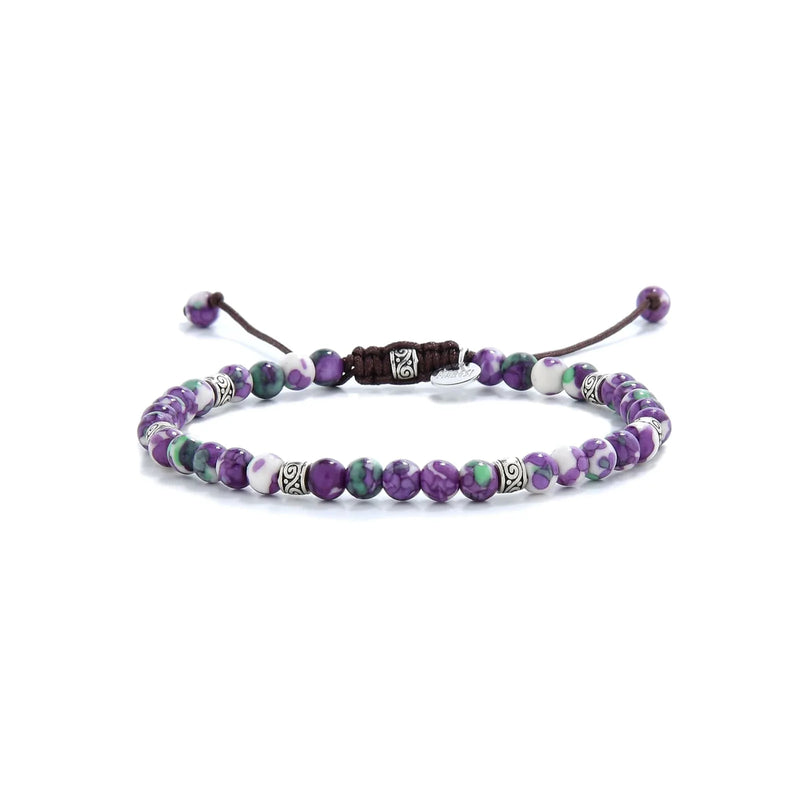 purple jasper bracelet with green, white beads and silver spacers.