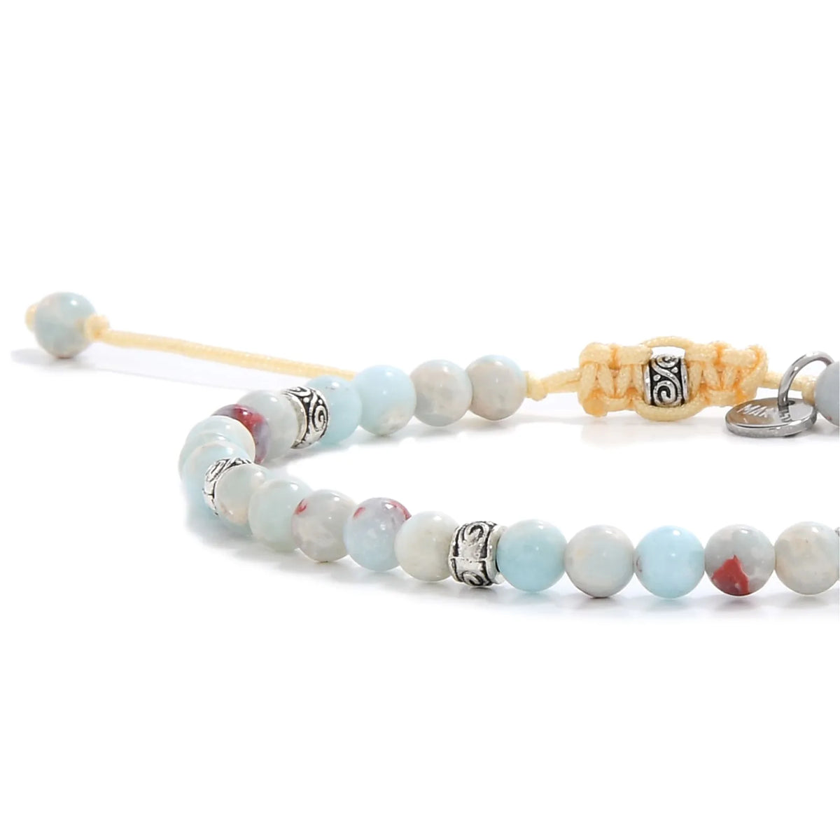 Side view of a Shoushan stone bracelet, showing its combination of soft blue and red-speckled beads, silver detailing, and knotted beige closure.