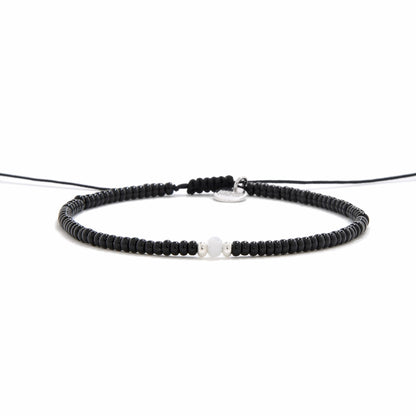 Full front view of Loreto Blanco Diamanti black bead bracelet with white and silver centerpiece