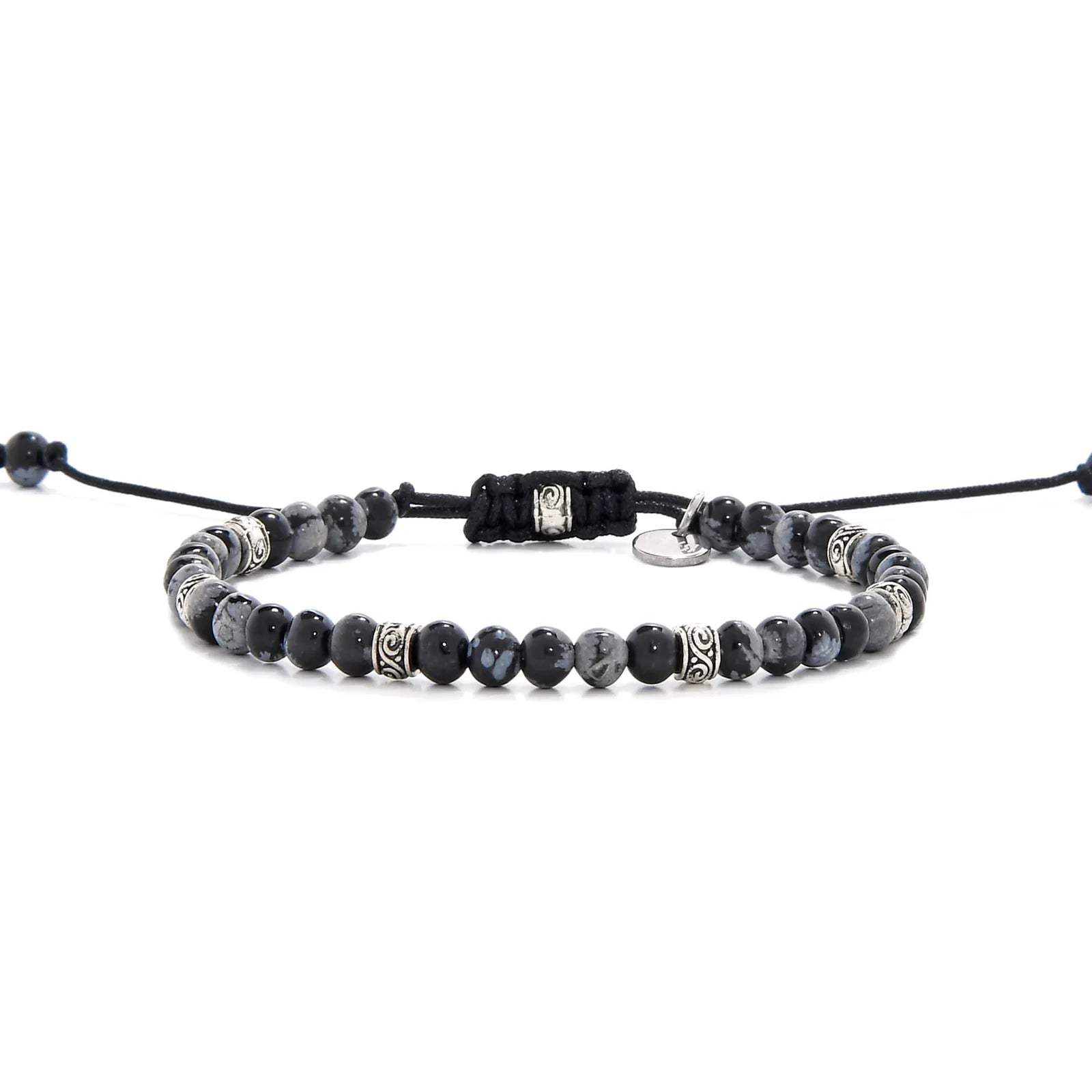Full view of bracelet black stone featuring black jasper beads and silver decorative spacers.
