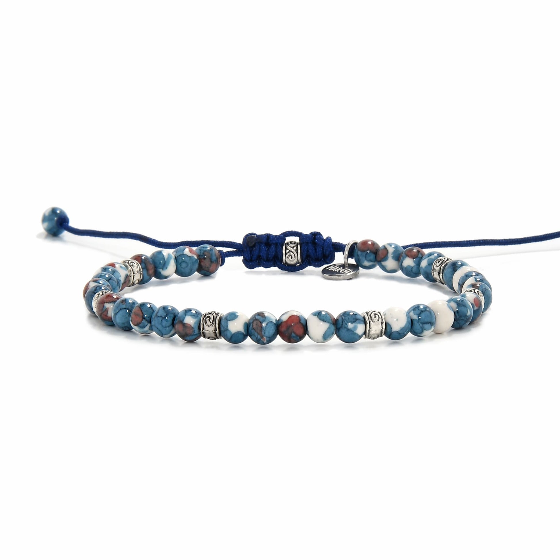Adjustable blue jasper bracelet with multicolor beads and silver spacers, styled in a circular layout on white background.
