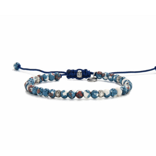 Close-up view of handcrafted blue jasper jewelry with silver accents