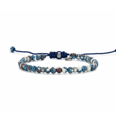Close-up view of handcrafted blue jasper bracelet  with silver accents
