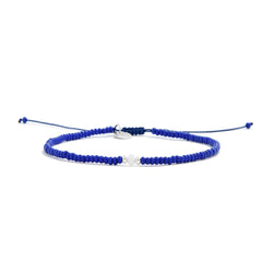 Blue seed bead bracelet idea with white bead centerpiece and navy adjustable cord