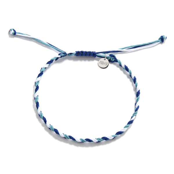Blue and white woven friendship bracelet with adjustable knot and charm in flat lay