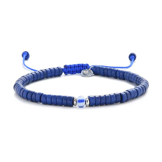 Elegant blue gemstone bracelet with central bead and cord