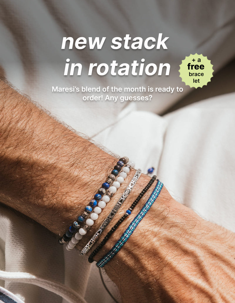 Stack of colorful beaded and braided bracelets for men on a wrist, inspired by Mediterranean style.
