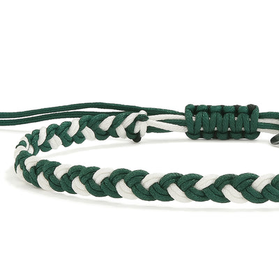 Detailed view of green and white braided adjustable friendship bracelet with knot closure