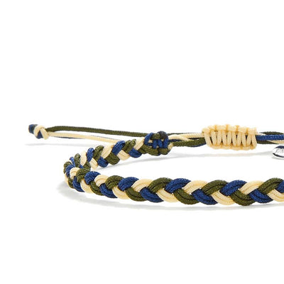 Close-up of matching friendship bracelet with detailed braided cord.