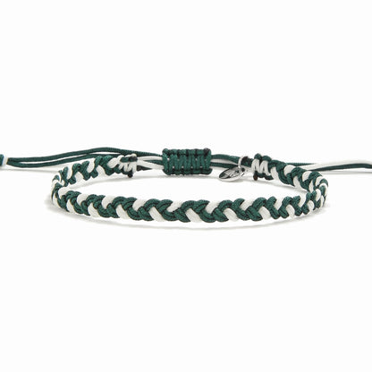Front display of Castel green and white woven friendship bracelet with knot and charm