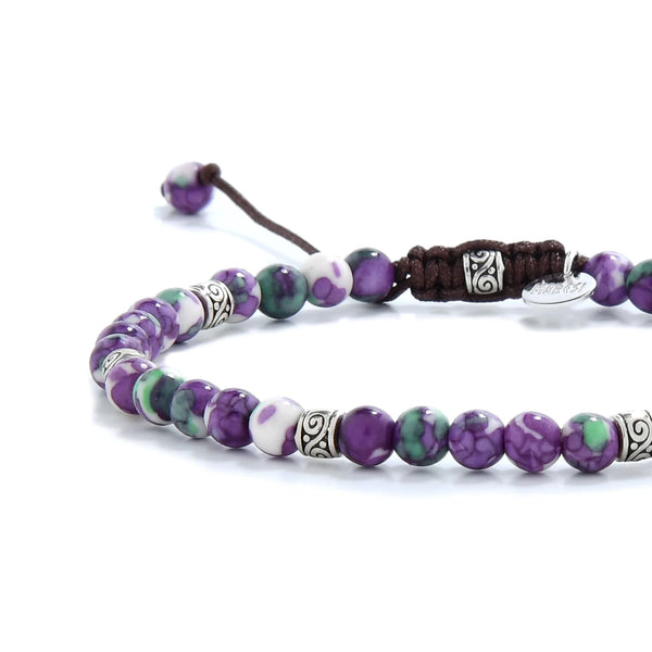 Purple jasper bracelet styled with ornate silver spacers and stone details.