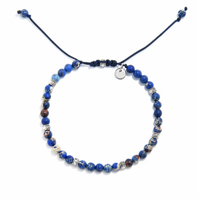 jasper stone bracelet featuring indigo sea sediment beads and silver accents on adjustable navy cord