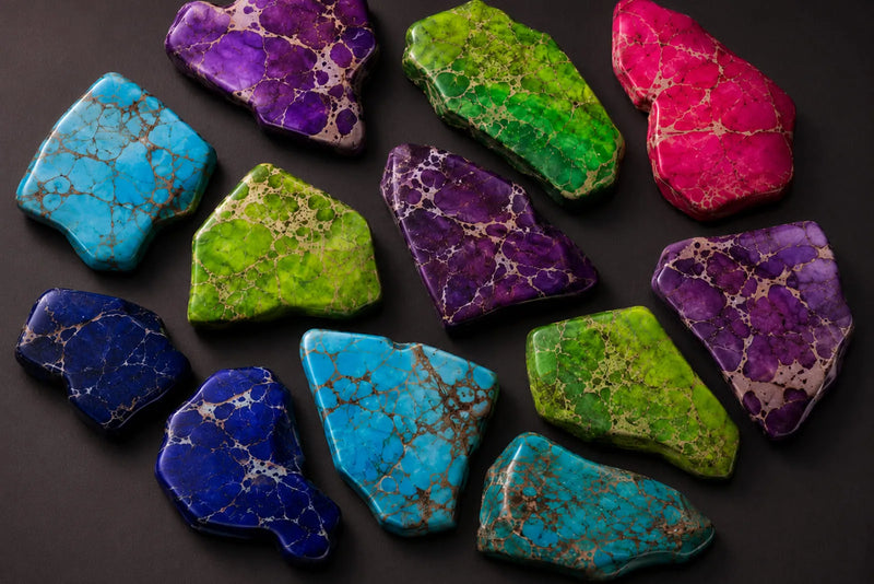 Sea Sediment Jasper stones in bright turquoise, purple, green, blue and pink colors with contrasting matrix patterns.