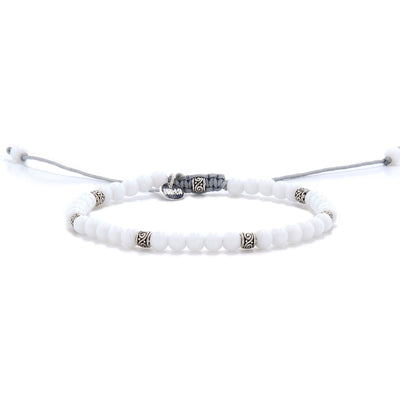 Elegant white jade stone bracelet with silver accents and adjustable cord.