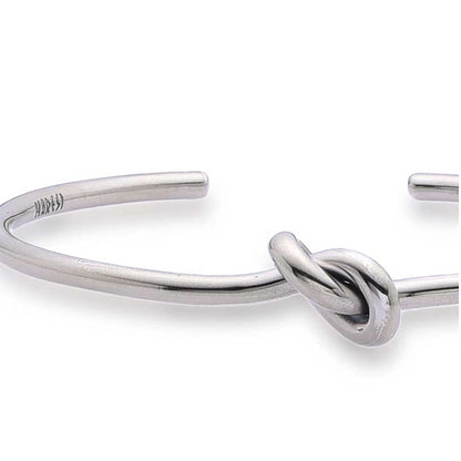 Close-up of knot detail on mens cuff bracelets.