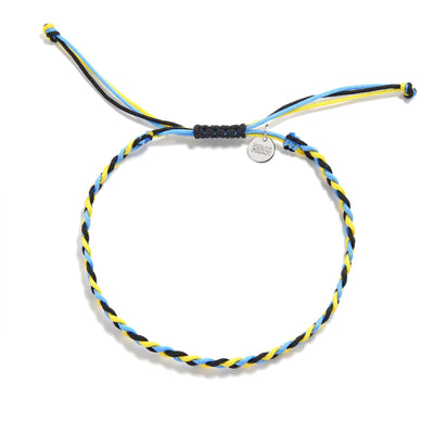 Flat lay of adjustable zig zag friendship bracelet in blue, yellow, and black with charm tag