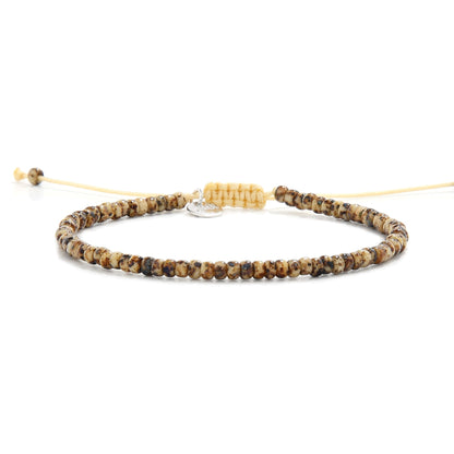  Flat lay of bead bracelet for men with Picasso-finish Czech beads and cream cord