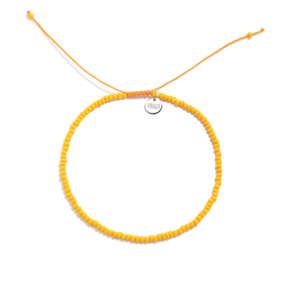 Top view orange men bead bracelet showing full circle design