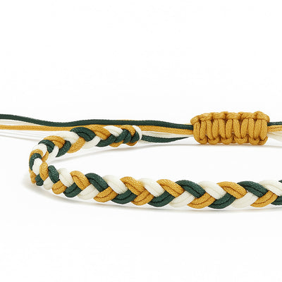 Braided friendship bracelet in blue, white, and gold colors, symbolizing trust and positivity.