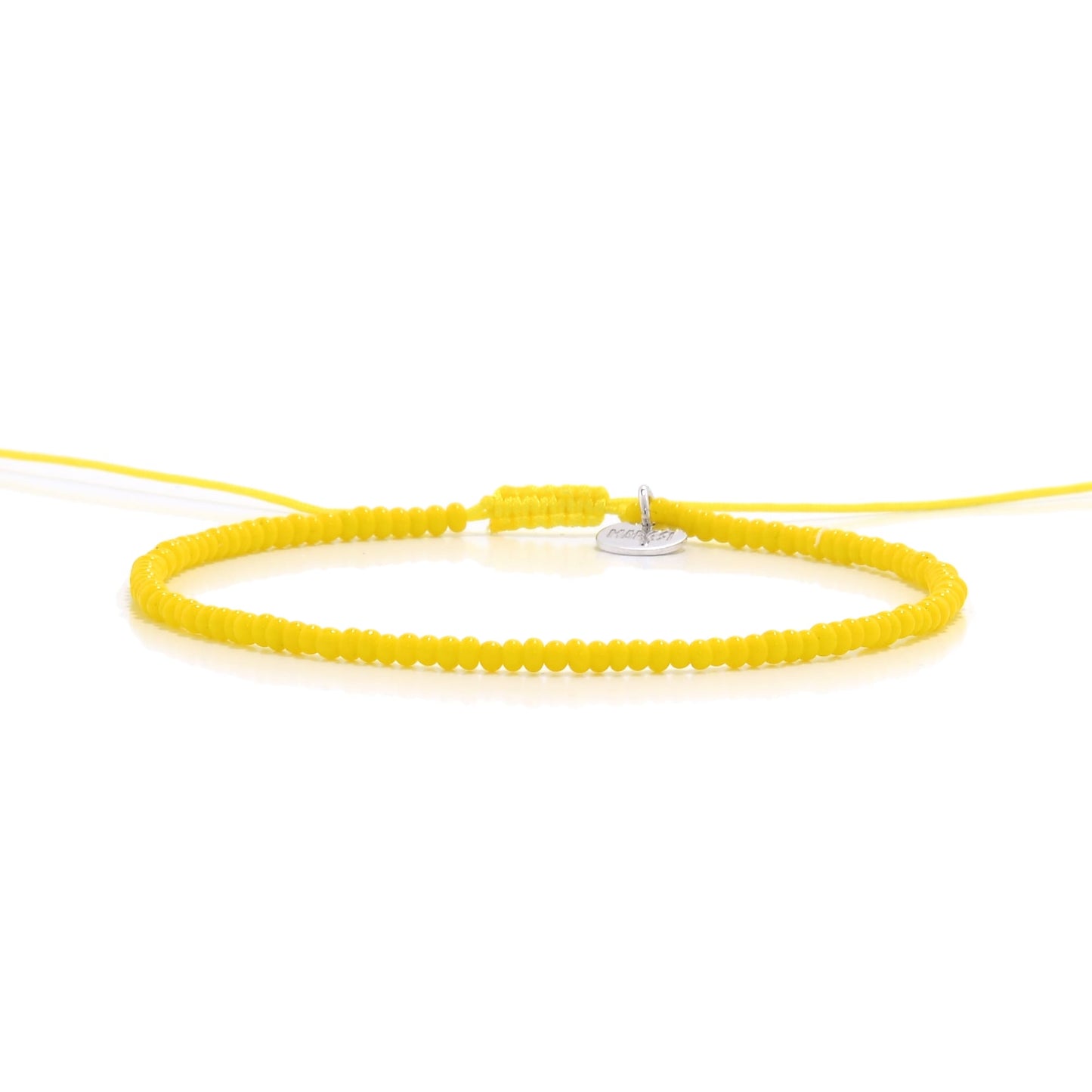 Straight-on image of bracelets beads in yellow with silver disc charm

