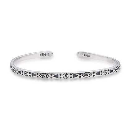 Symmetrical view of mens stainless steel bracelet with symbolic patterns