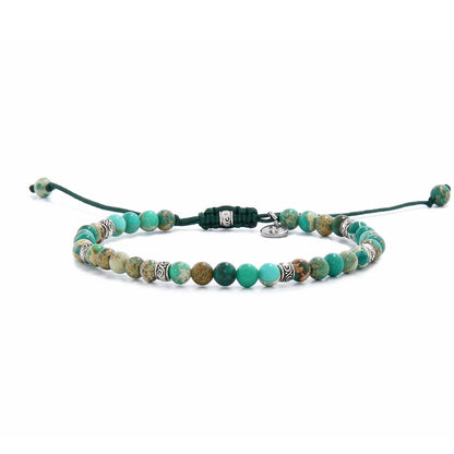 Green Jasper Bracelet full view with turquoise green beads, patterned stones, silver spacers, and green cord.