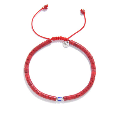 Top view of red gemstone bracelet made with red clay beads and a blue glass centerpiece