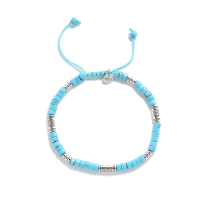Handmade Bracelet of Clay with blue beads and metal accents.