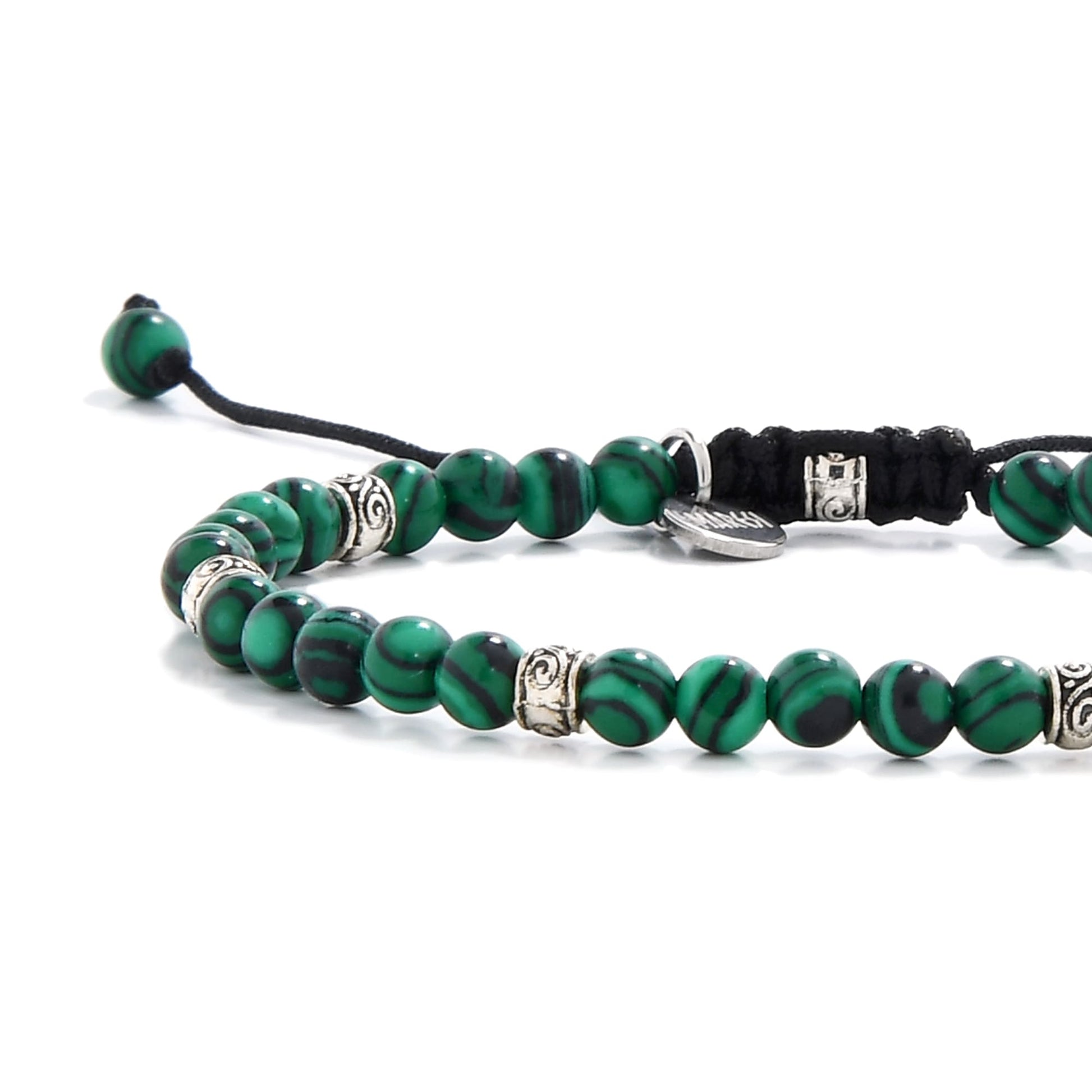 Malachite jewelry beads close-up showing bold green and black striping

