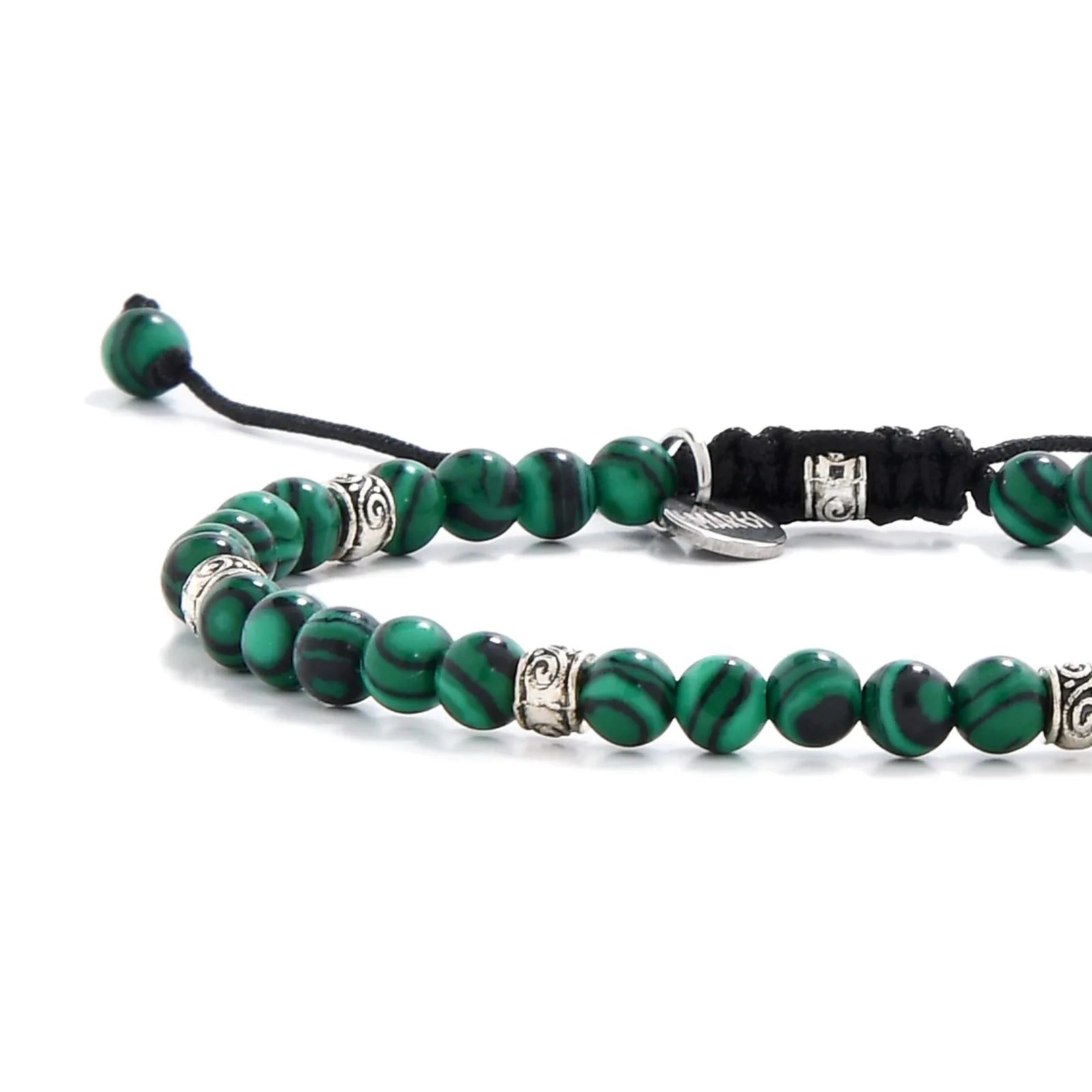 Malachite jewelry beads close-up showing bold green and black striping

