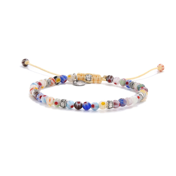 Handmade millefiori beads bracelet featuring colorful glass beads and metal spacers.