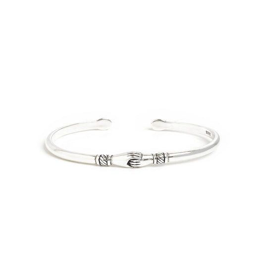 Stainless steel bracelets with symbolic handshake design.
