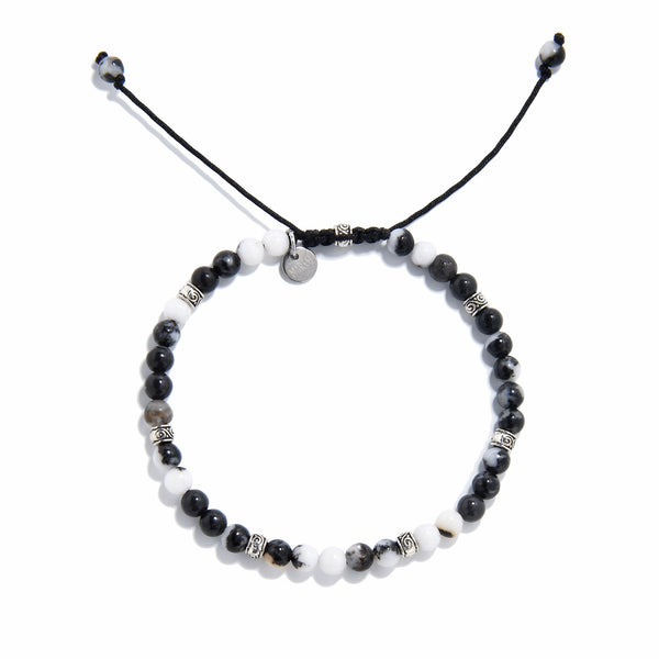 Top view of handmade zebra jasper bracelet with natural gemstone beads and silver accents.