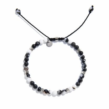 Top view of handmade zebra jasper bracelet with natural gemstone beads and silver accents.