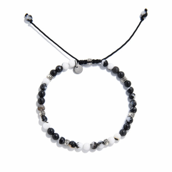 Top view of handmade zebra jasper bracelet with natural gemstone beads and silver accents.