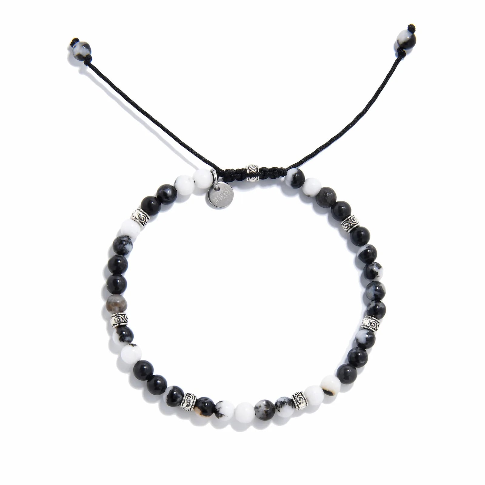 Top view of handmade zebra jasper bracelet featuring natural black and white gemstone beads with silver accents.